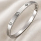 Maglina Éternité Armreif Damen Öffenbar – Eleganter Edelstahl Bangle mit 10 Zirkonia | Silber, Wasserfest & Nickelfrei | Designed in Germany | Schmuck Geschenk für Frauen | Ø 6 cm